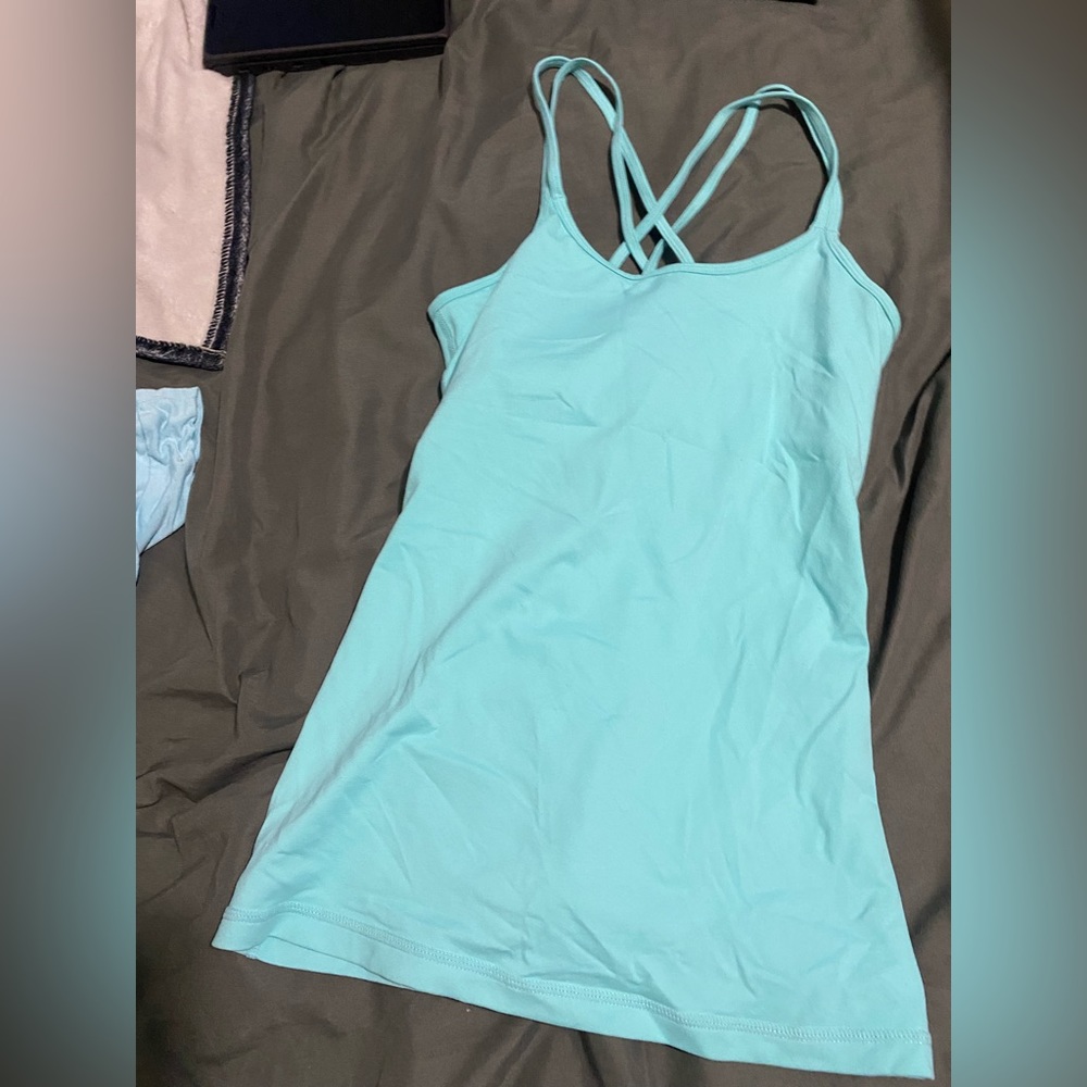 Baleaf athletic tank top it’s a baby blue/teal color